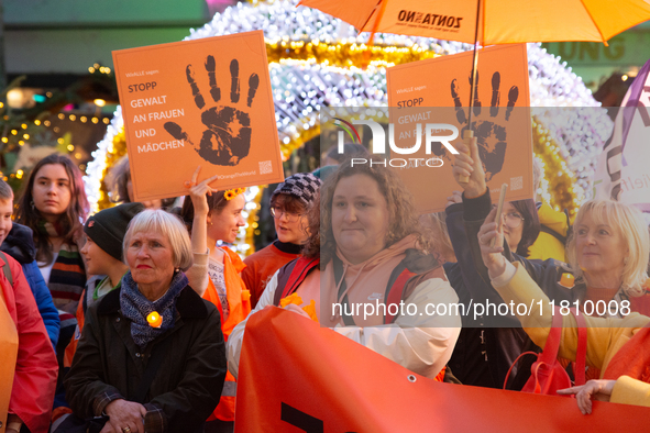 A hundred participants take part in a demonstration for International Women's Day in Bonn, Germany, on November 25, 2024, to raise awareness...