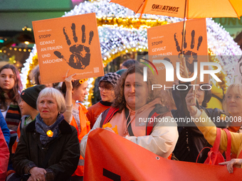 A hundred participants take part in a demonstration for International Women's Day in Bonn, Germany, on November 25, 2024, to raise awareness...