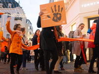 A hundred participants take part in a demonstration for International Women's Day in Bonn, Germany, on November 25, 2024, to raise awareness...