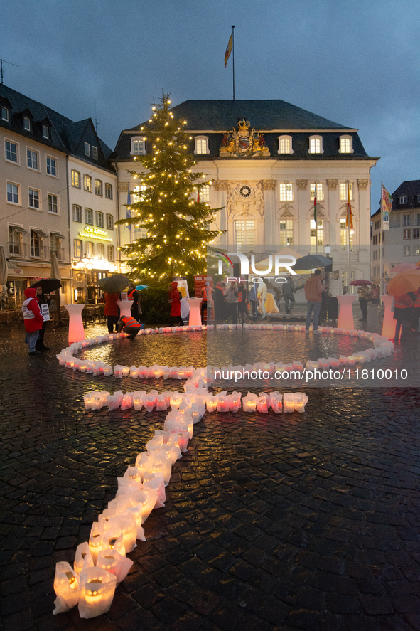 365 candles with the symbol of a woman are illuminated in front of the Townhall as hundreds of participants take part in a demonstration for...