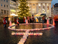 365 candles with the symbol of a woman are illuminated in front of the Townhall as hundreds of participants take part in a demonstration for...