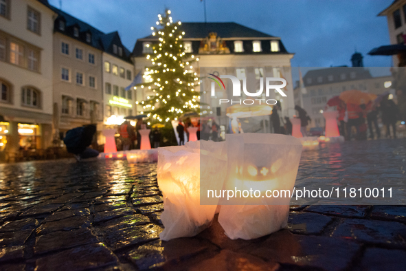 365 candles with the symbol of a woman are illuminated in front of the Townhall as hundreds of participants take part in a demonstration for...