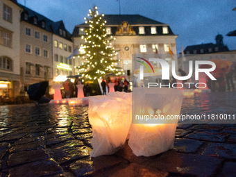 365 candles with the symbol of a woman are illuminated in front of the Townhall as hundreds of participants take part in a demonstration for...