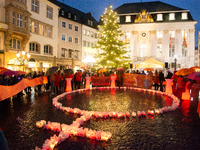 365 candles with the symbol of a woman are illuminated in front of the Townhall as hundreds of participants take part in a demonstration for...