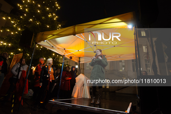 Katja Dorner, the mayor of Bonn, speaks during the candlelight vigil in front of Bonn Town Hall as hundreds of participants take part in a d...