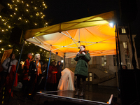 Katja Dorner, the mayor of Bonn, speaks during the candlelight vigil in front of Bonn Town Hall as hundreds of participants take part in a d...