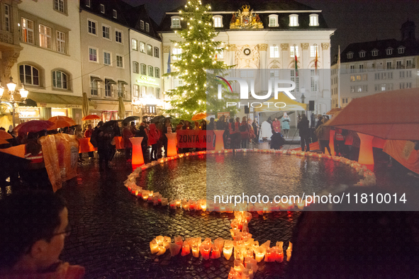 365 candles with the symbol of a woman are illuminated in front of the Townhall as hundreds of participants take part in a demonstration for...