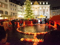 365 candles with the symbol of a woman are illuminated in front of the Townhall as hundreds of participants take part in a demonstration for...