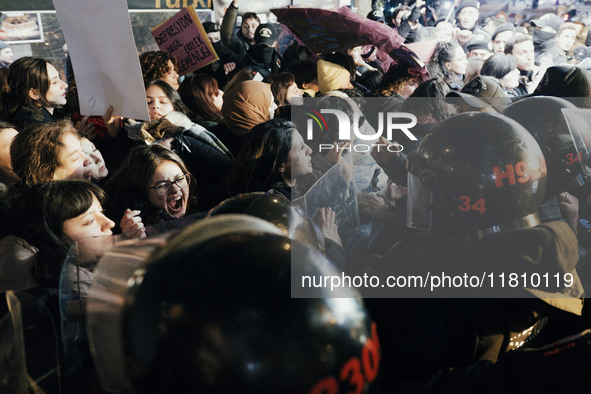 Women are surrounded by police as they demonstrate to mark the International Day for the Elimination of Violence against Women in Istanbul,...