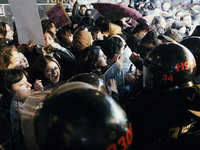 Women are surrounded by police as they demonstrate to mark the International Day for the Elimination of Violence against Women in Istanbul,...