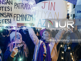 Women attend a demonstration to mark the International Day for the Elimination of Violence against Women near Istiklal Avenue in Istanbul, T...