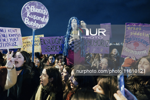 Women attend a demonstration to mark the International Day for the Elimination of Violence against Women near Istiklal Avenue in Istanbul, T...