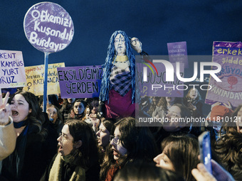 Women attend a demonstration to mark the International Day for the Elimination of Violence against Women near Istiklal Avenue in Istanbul, T...