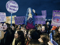 Women attend a demonstration to mark the International Day for the Elimination of Violence against Women near Istiklal Avenue in Istanbul, T...