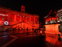 The facade of the Palazzo Senatorio of the Campidoglio in Rome, seat of the municipal administration, is lit up in red on the occasion of th...