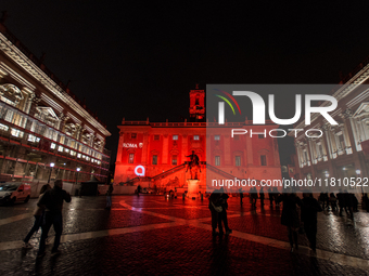 The facade of the Palazzo Senatorio of the Campidoglio in Rome, seat of the municipal administration, is lit up in red on the occasion of th...