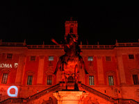 The facade of the Palazzo Senatorio of the Campidoglio in Rome, seat of the municipal administration, is lit up in red on the occasion of th...