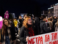 A protester shouts slogans during a rally in front of the Greek Parliament to mark the International Day for the Elimination of Violence aga...