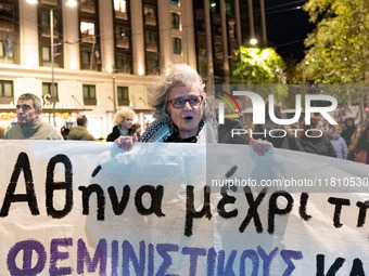 A protester shouts slogans during a rally in front of the Greek Parliament to mark the International Day for the Elimination of Violence aga...