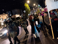 A protester shouts slogans during a rally in front of the Greek Parliament to mark the International Day for the Elimination of Violence aga...