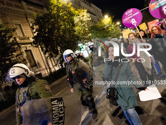 A protester shouts slogans during a rally in front of the Greek Parliament to mark the International Day for the Elimination of Violence aga...