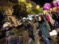 A protester shouts slogans during a rally in front of the Greek Parliament to mark the International Day for the Elimination of Violence aga...