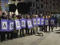 A group of women with signs reading ''murdered'' take part in the demonstration for the International Day for the Elimination of Violence ag...