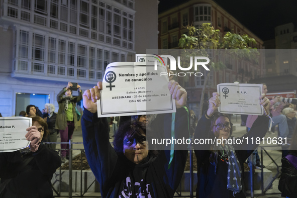 Women carry obituaries of women killed during the demonstration for the International Day for the Elimination of Violence against Women in t...