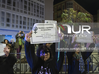 Women carry obituaries of women killed during the demonstration for the International Day for the Elimination of Violence against Women in t...