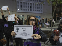 Women carry obituaries of women killed during the demonstration for the International Day for the Elimination of Violence against Women in t...