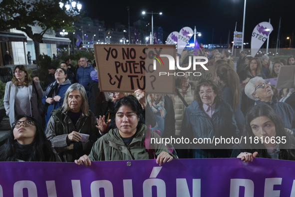 A woman holds a sign that says ''I'm not a pimp and you?'' demanding the abolition of prostitution during the demonstration for the Internat...