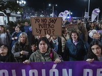 A woman holds a sign that says ''I'm not a pimp and you?'' demanding the abolition of prostitution during the demonstration for the Internat...