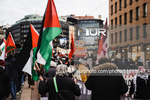 Demonstrators participate in a pro-Palestinian protest in Piazza Duomo in Milan, Italy, on November 23, 2024 