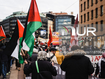 Demonstrators participate in a pro-Palestinian protest in Piazza Duomo in Milan, Italy, on November 23, 2024 (