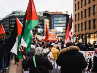 Demonstrators participate in a pro-Palestinian protest in Piazza Duomo in Milan, Italy, on November 23, 2024 (