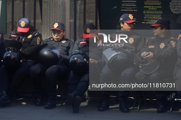 A group of women rests in Mexico City, Mexico, on November 25, 2024, in the streets, coinciding with the International Day for the Eliminati...