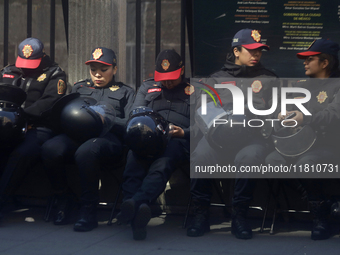 A group of women rests in Mexico City, Mexico, on November 25, 2024, in the streets, coinciding with the International Day for the Eliminati...