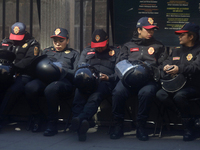 A group of women rests in Mexico City, Mexico, on November 25, 2024, in the streets, coinciding with the International Day for the Eliminati...