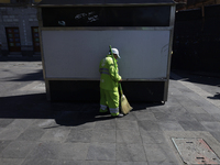 A cleaning worker is on the streets of the Zocalo in Mexico City, Mexico, on November 25, 2024, which coincides with the International Day f...