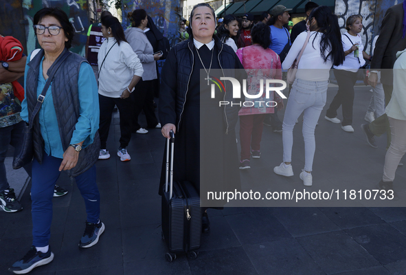 A nun is in the streets of the Zocalo in Mexico City, Mexico, on November 25, 2024, which coincides with the International Day for the Elimi...