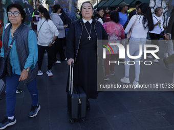 A nun is in the streets of the Zocalo in Mexico City, Mexico, on November 25, 2024, which coincides with the International Day for the Elimi...