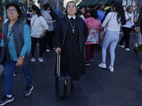 A nun is in the streets of the Zocalo in Mexico City, Mexico, on November 25, 2024, which coincides with the International Day for the Elimi...