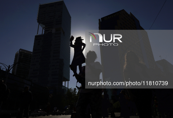 Mothers, relatives of missing persons and victims of femicide, feminist collectives, and various organizations hold silhouettes while protes...