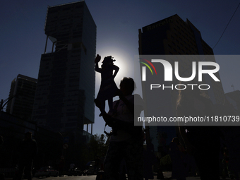 Mothers, relatives of missing persons and victims of femicide, feminist collectives, and various organizations hold silhouettes while protes...