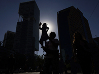 Mothers, relatives of missing persons and victims of femicide, feminist collectives, and various organizations hold silhouettes while protes...