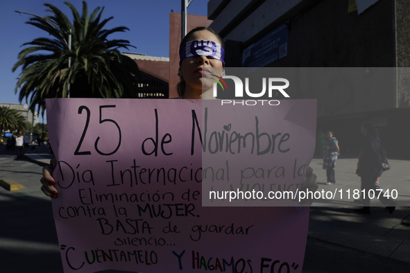 A woman protests in Mexico City, Mexico, on November 25, 2024, on the occasion of the International Day for the Elimination of Violence agai...