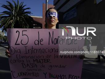 A woman protests in Mexico City, Mexico, on November 25, 2024, on the occasion of the International Day for the Elimination of Violence agai...