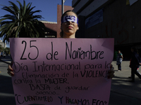 A woman protests in Mexico City, Mexico, on November 25, 2024, on the occasion of the International Day for the Elimination of Violence agai...