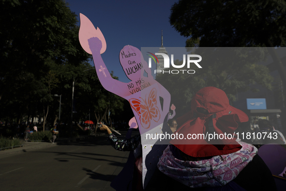 Mothers, relatives of missing persons and victims of femicide, feminist collectives, and various organizations hold silhouettes while protes...