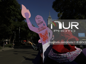 Mothers, relatives of missing persons and victims of femicide, feminist collectives, and various organizations hold silhouettes while protes...